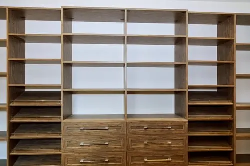 Custom built-in closet shelving system with drawers and hanging space